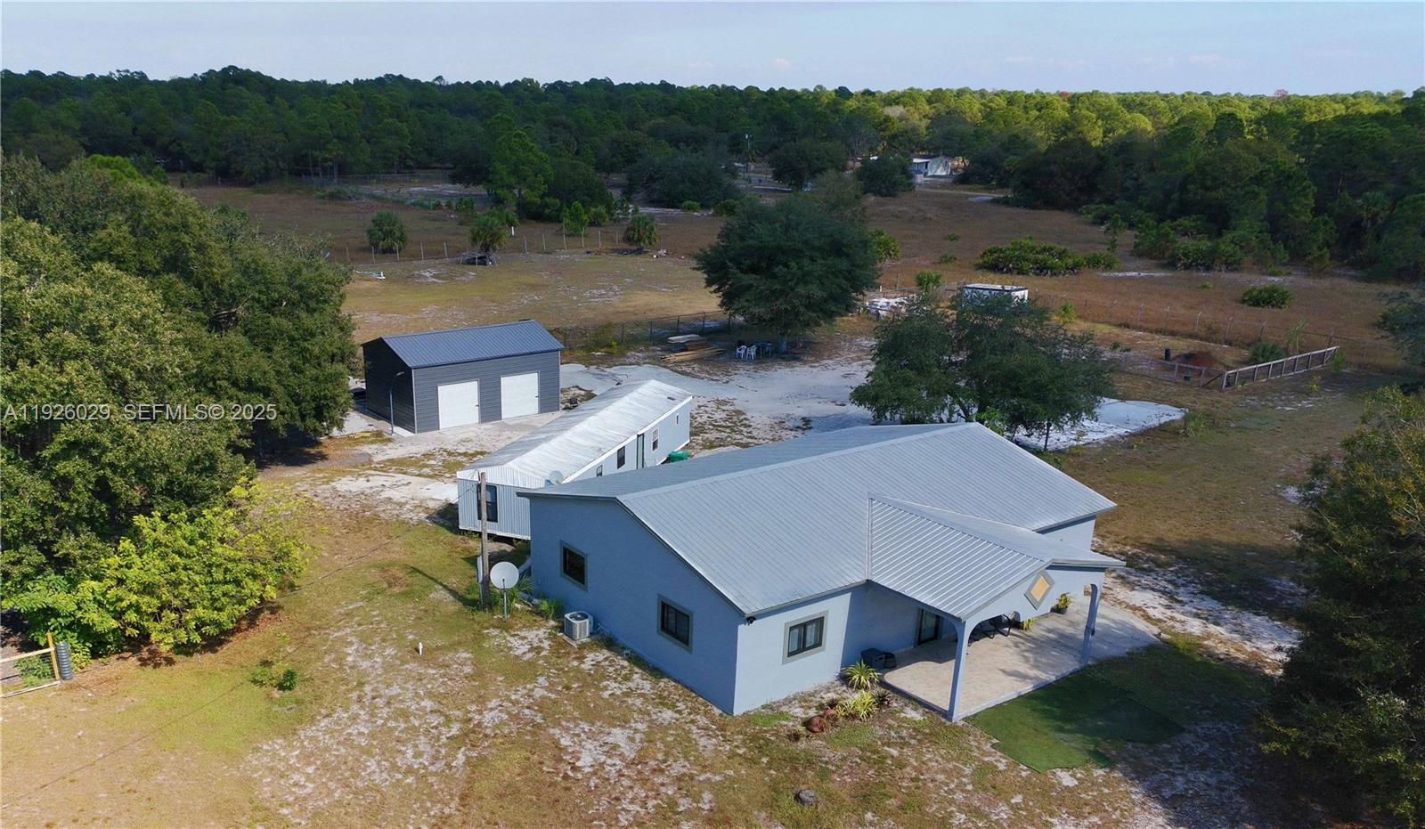 527 Perimeter Road Clewiston, FL 33440 - Photo 34 of 40 an aerial view of a house with a yard