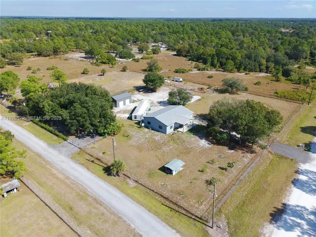 a view of a swimming pool with a yard