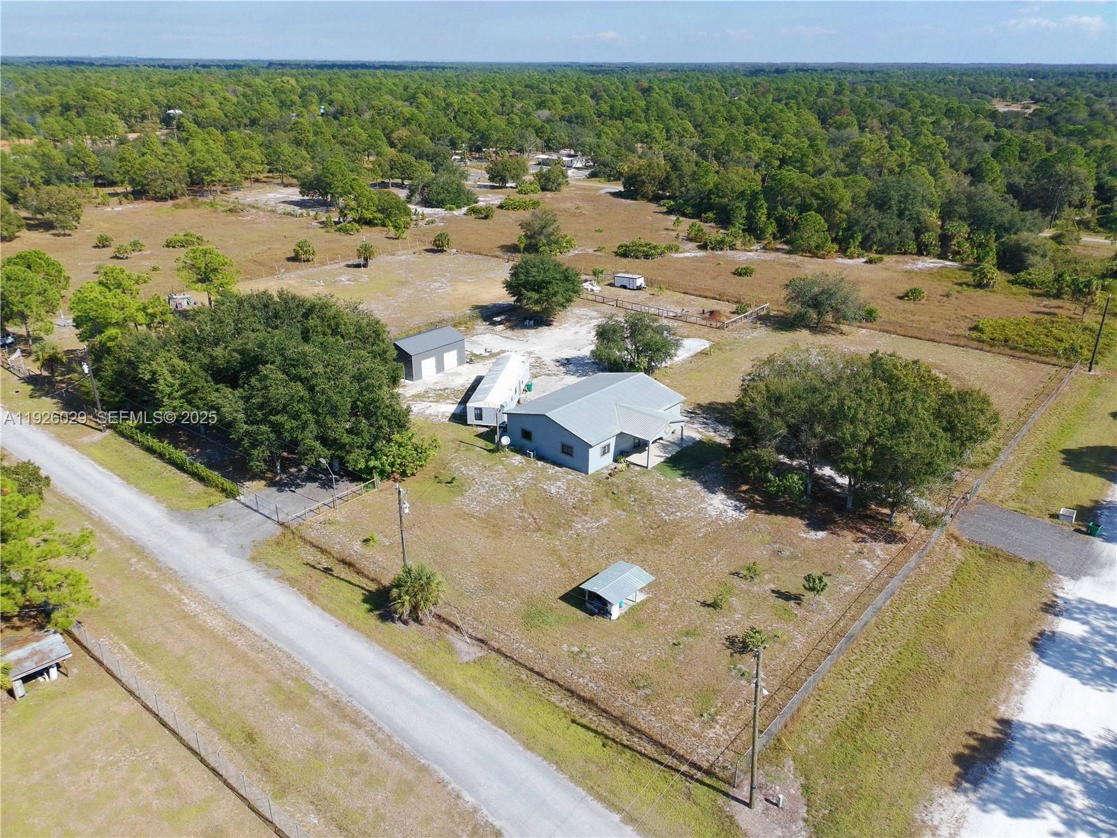 527 Perimeter Road Clewiston, FL 33440 - Photo 39 of 40 a view of a swimming pool with a yard