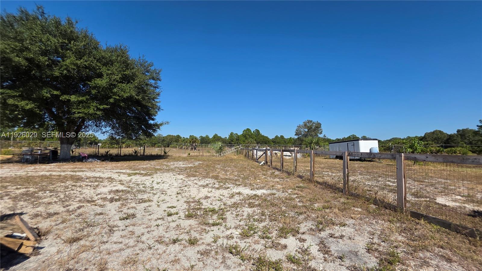 527 Perimeter Road Clewiston, FL 33440 - Photo 40 of 40 a view of a yard next to a yard