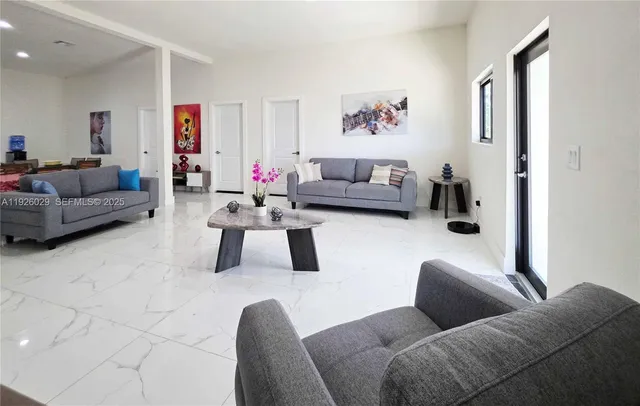 a living room with furniture and a couch