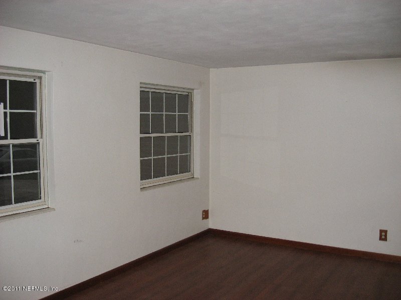 6732 Heidi Road Jacksonville, FL 32277 - Photo 3 of 10 an empty room with windows