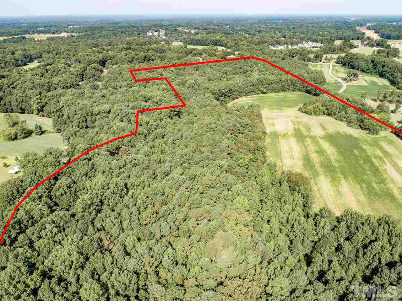 0 Stancil Farm Road Raleigh, NC 27603 - Photo 3 of 4 an aerial view of residential houses with outdoor space and swimming pool