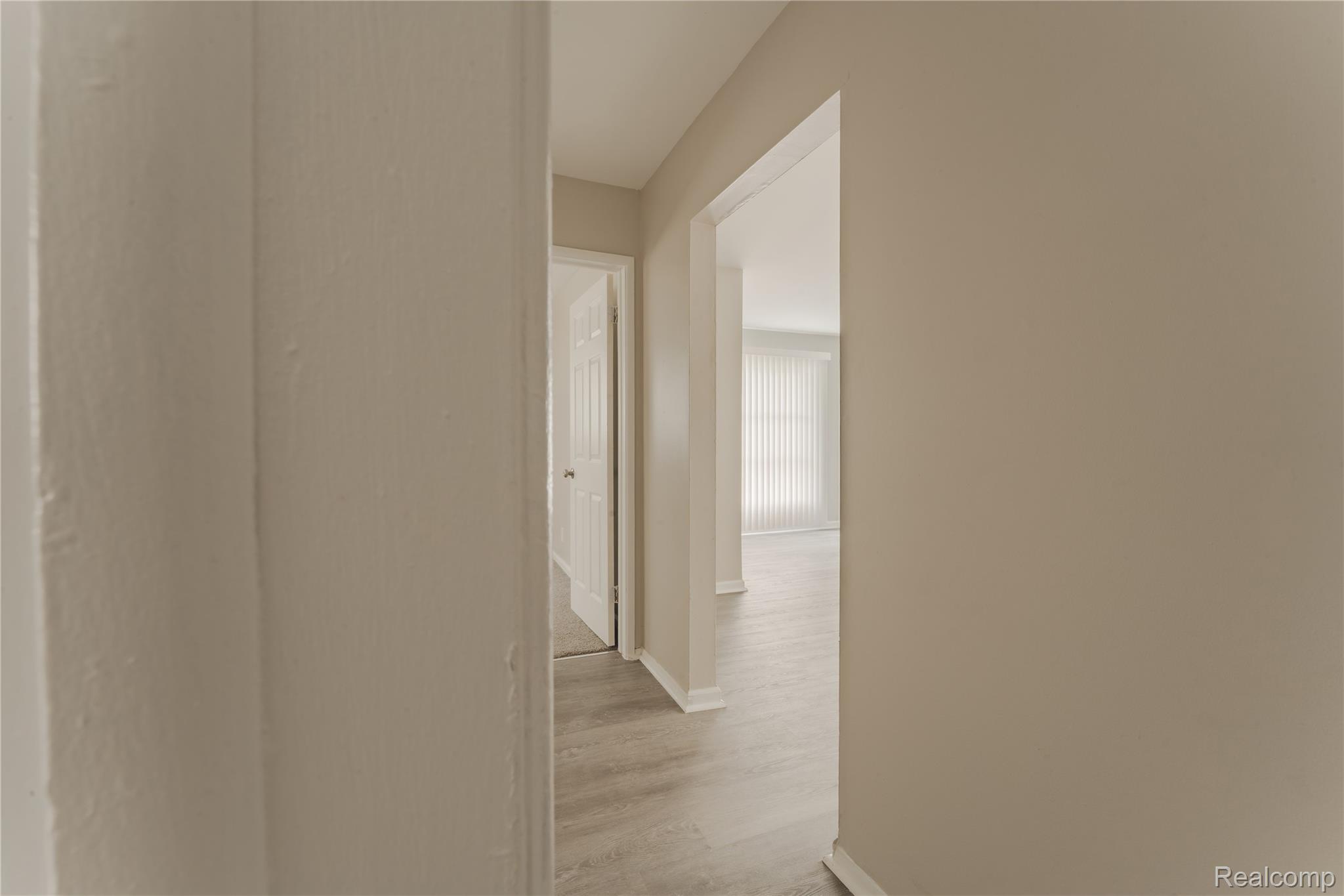 93 West Princeton Avenue Pontiac, MI 48340 - Photo 13 of 31 Hallway with light gray wood-finish flooring and neutral wall tones