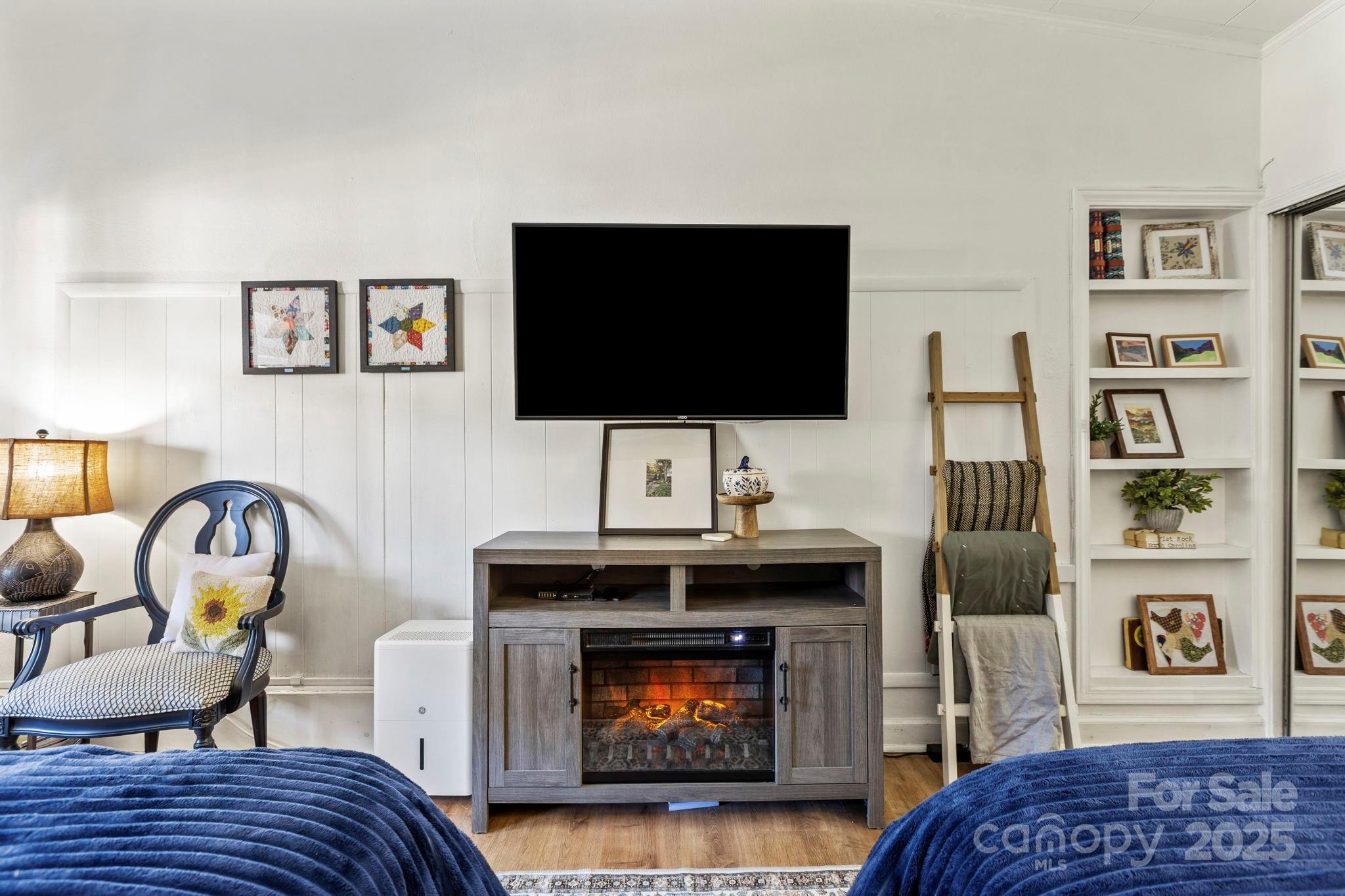 130 Old Mill Road, Unit 202 Flat Rock, NC 28731 - Photo 3 of 25 a living room with furniture and a fireplace