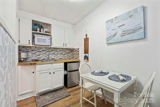 a kitchen with a stove and cabinets