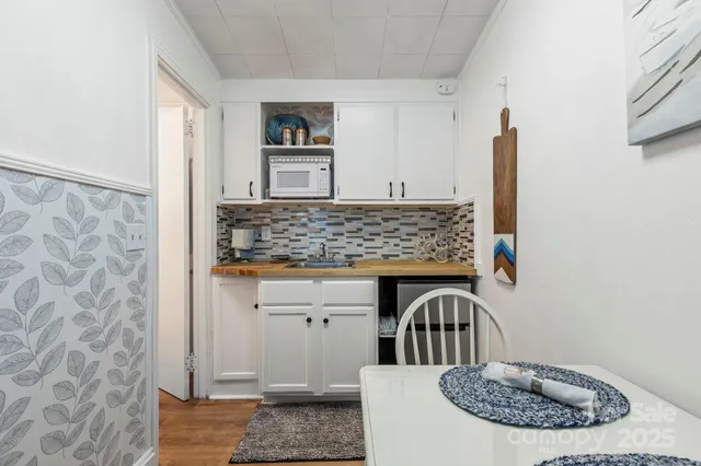 a view of cabinets with wooden floor