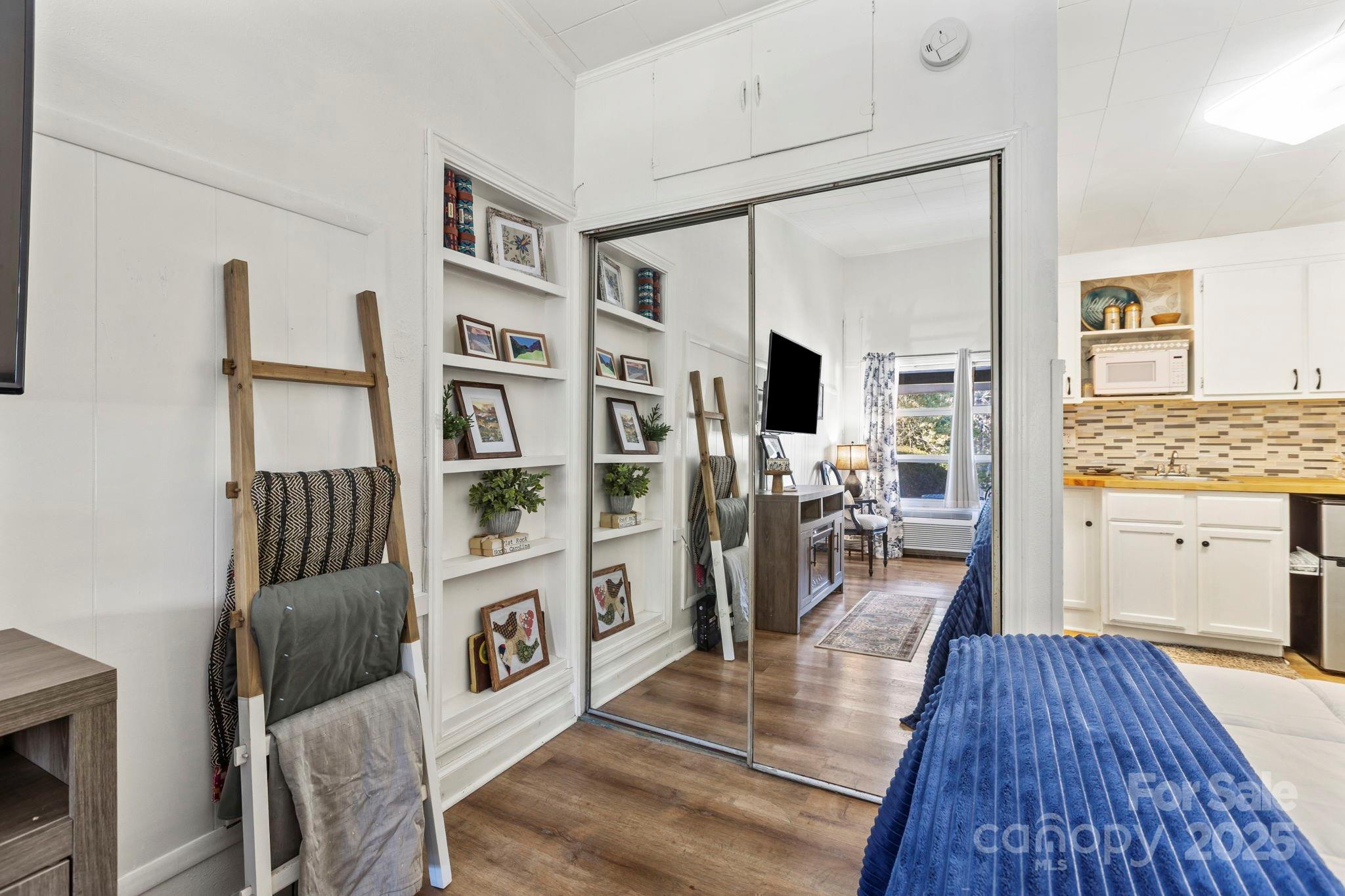 130 Old Mill Road, Unit 202 Flat Rock, NC 28731 - Photo 10 of 25 a living room with furniture and a wooden floor
