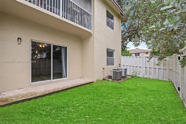 a view of an house with backyard porch and furniture