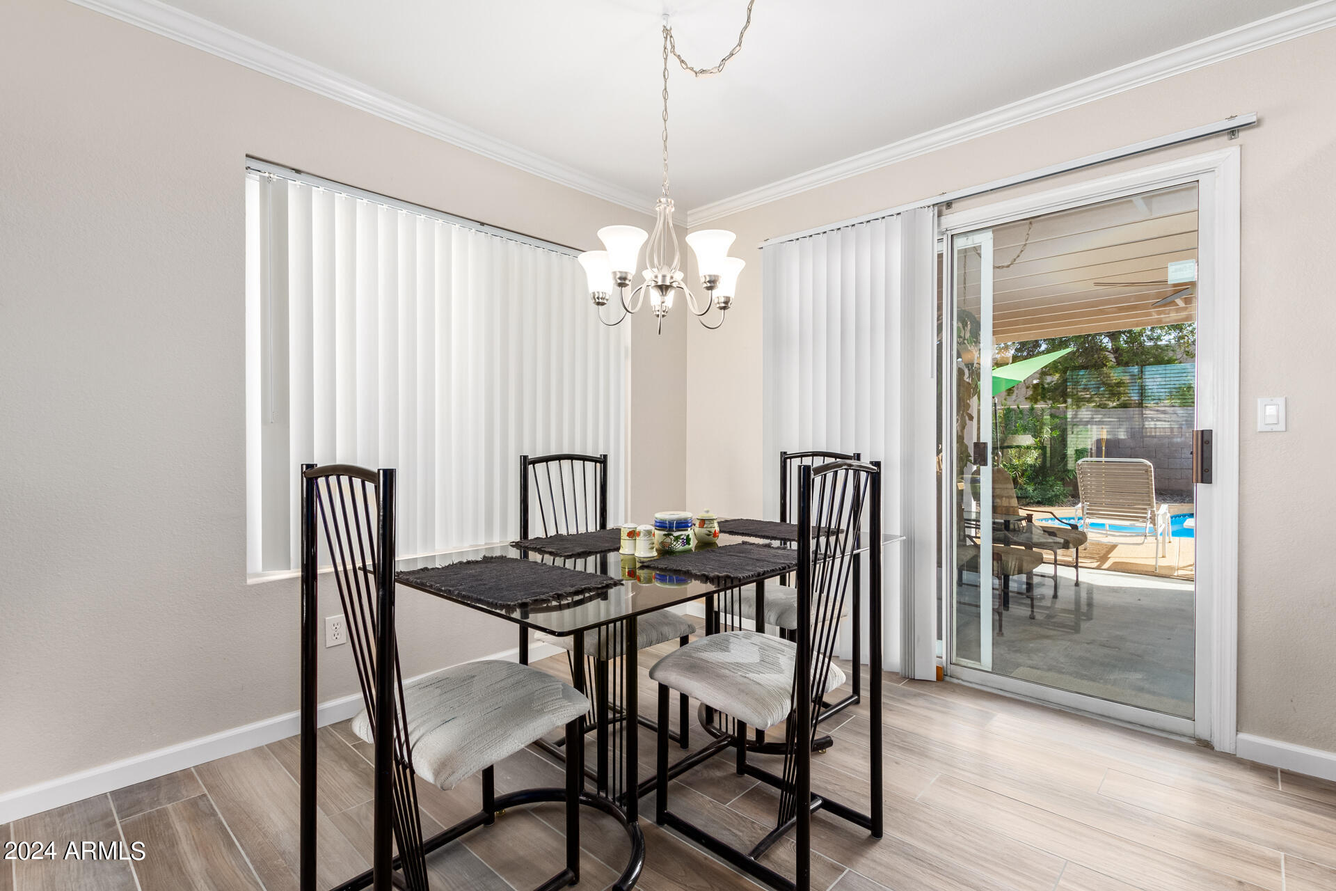 5131 Casper Road Mesa, AZ 85205 - Photo 17 of 32 a view of a dining room with furniture and chandelier