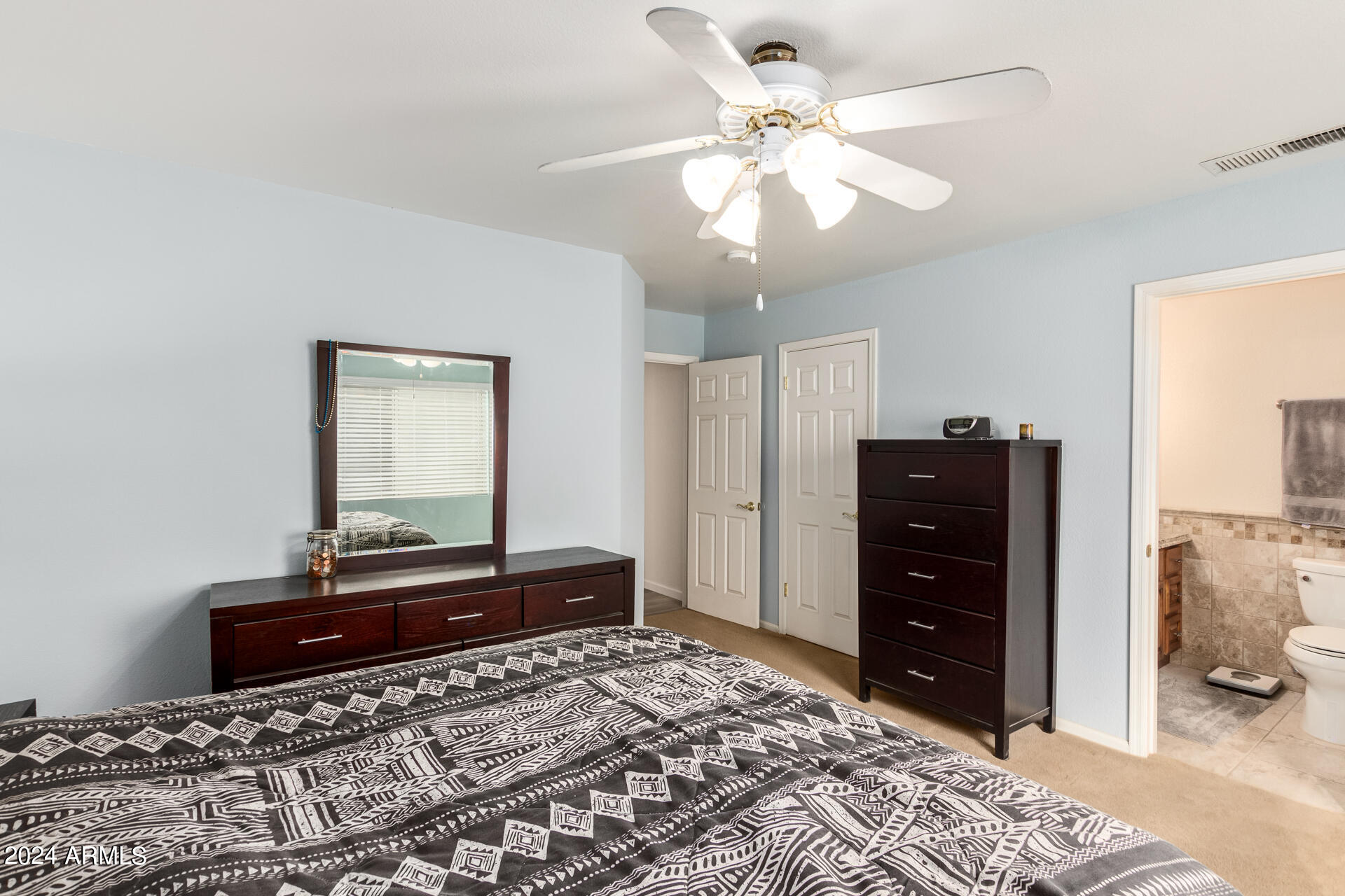 5131 Casper Road Mesa, AZ 85205 - Photo 20 of 32 a bedroom with a bed and a dresser