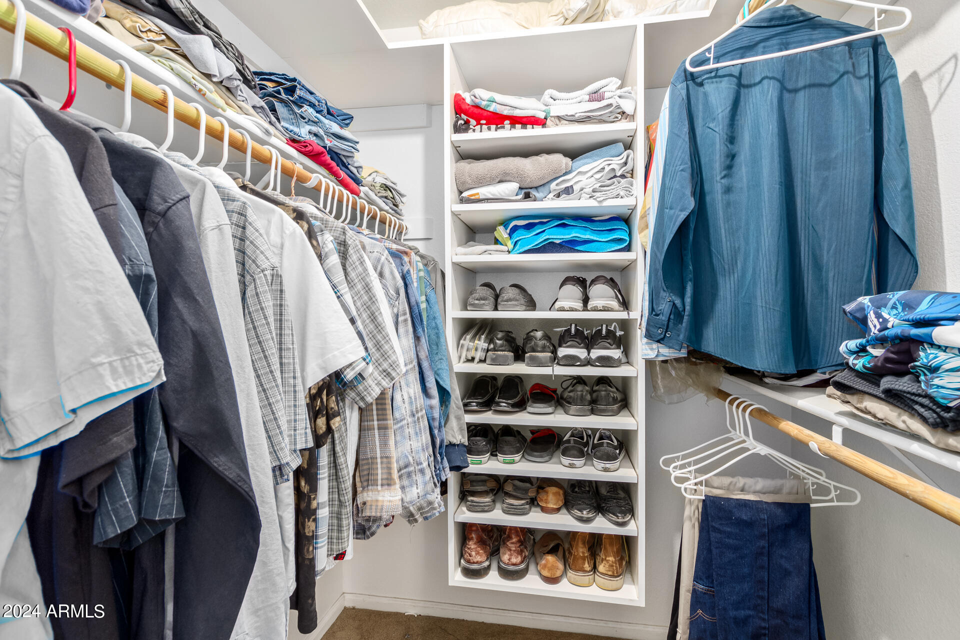 5131 Casper Road Mesa, AZ 85205 - Photo 23 of 32 a view of walk in closet with clothes and shoes