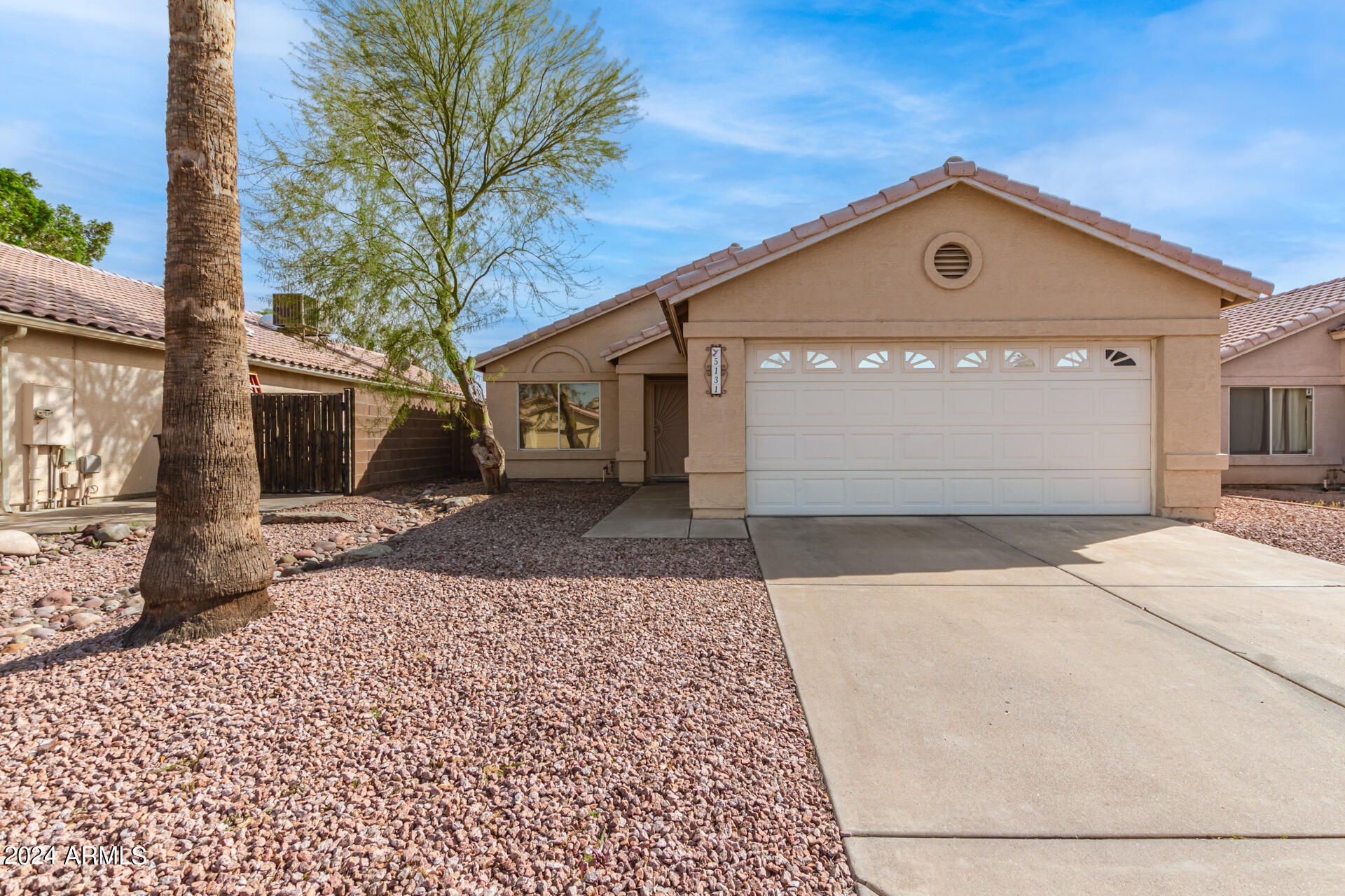 5131 Casper Road Mesa, AZ 85205 - Photo 32 of 32 a front view of a house with a yard and garage