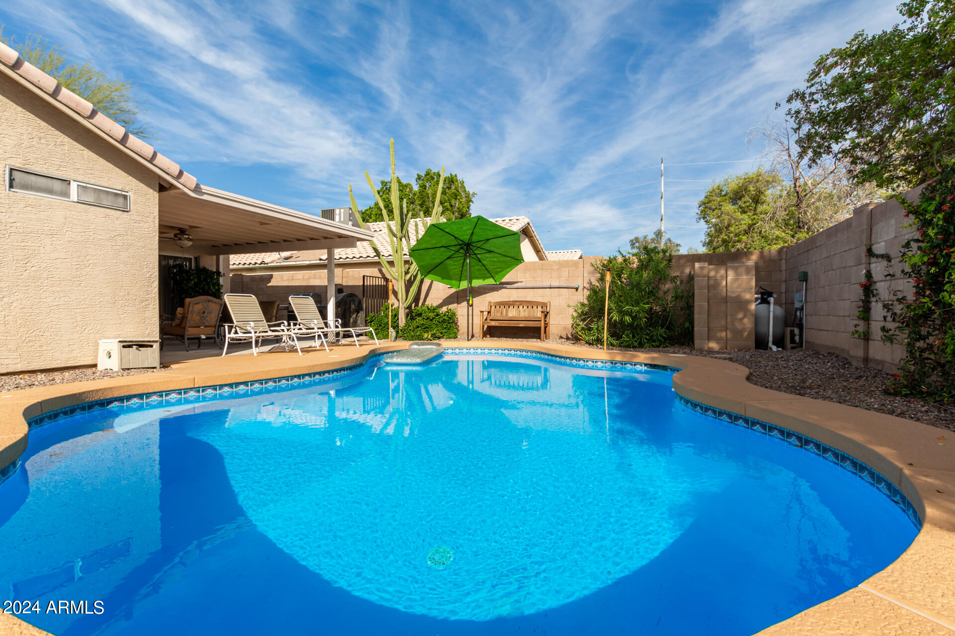 5131 Casper Road Mesa, AZ 85205 - Photo 4 of 32 a swimming pool with outdoor seating