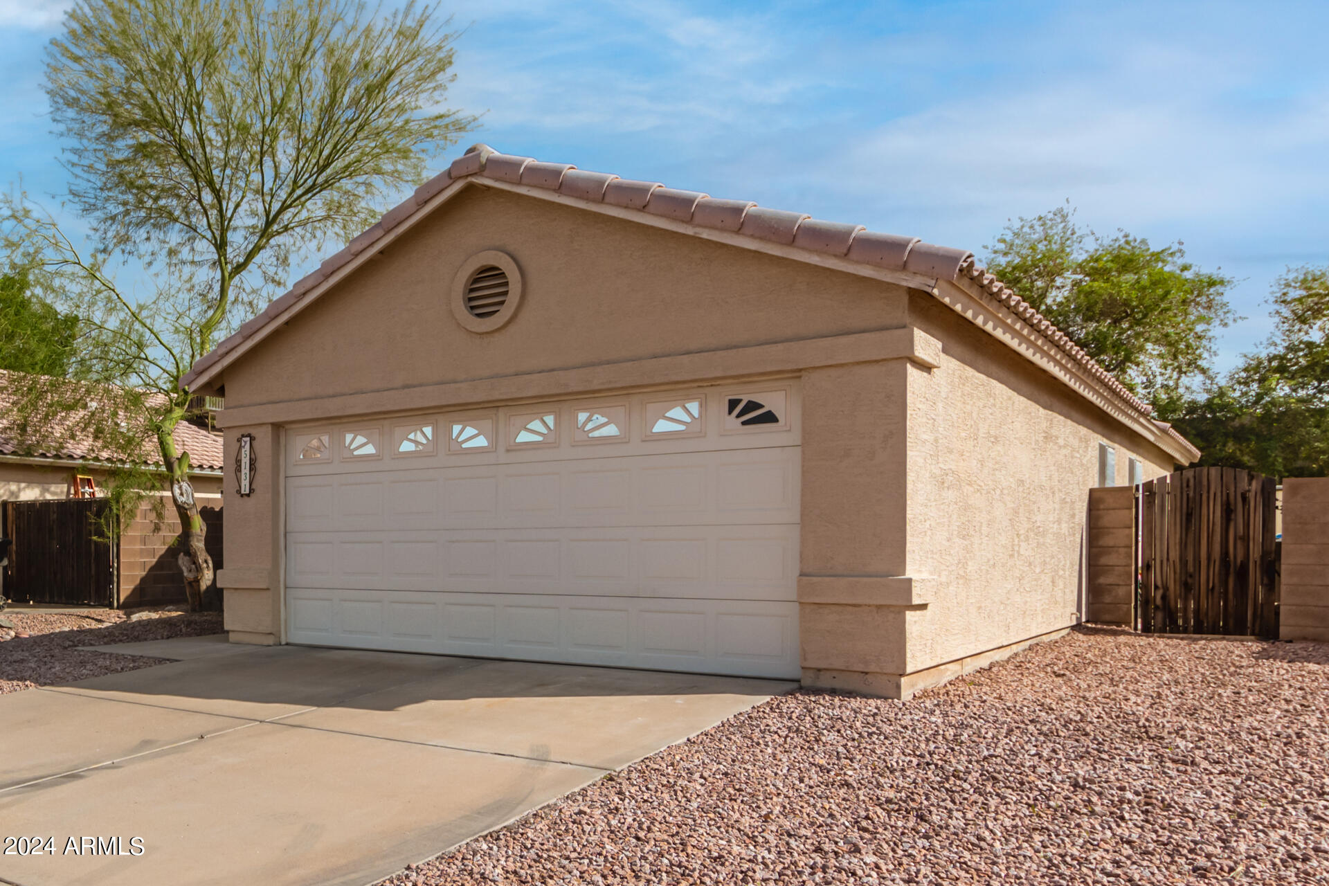 5131 Casper Road Mesa, AZ 85205 - Photo 6 of 32 a front view of a house with a yard
