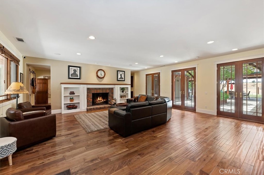 16420 Rocky Glen Road Perris, CA 92570 - Photo 12 of 74 a living room with furniture and a fireplace