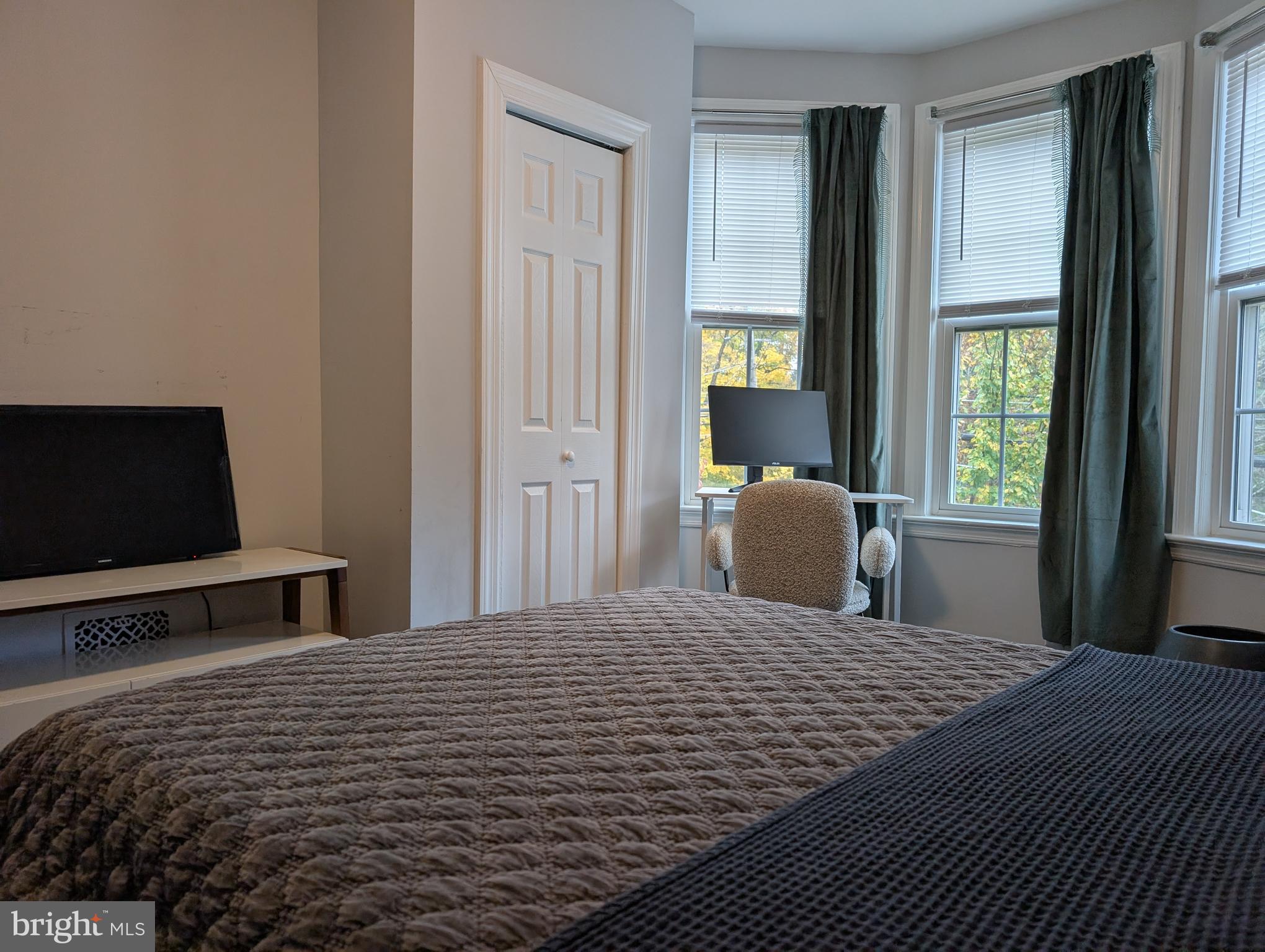 156 Mercer Street Princeton, NJ 08540 - Photo 11 of 24 a bedroom with a bed and flat screen tv