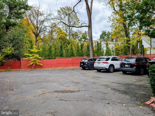 a view of cars parked on a street side