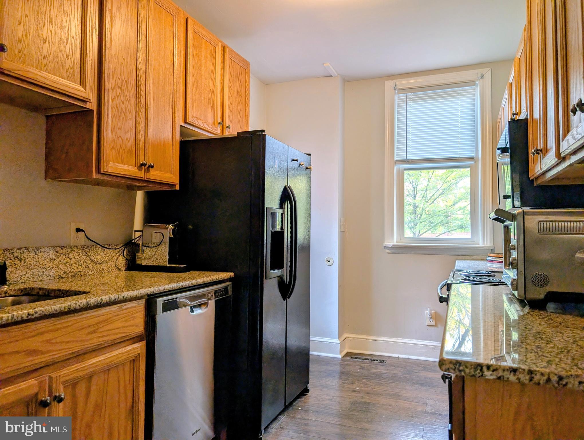 156 Mercer Street Princeton, NJ 08540 - Photo 6 of 24 a kitchen with stainless steel appliances granite countertop a refrigerator and a stove top oven