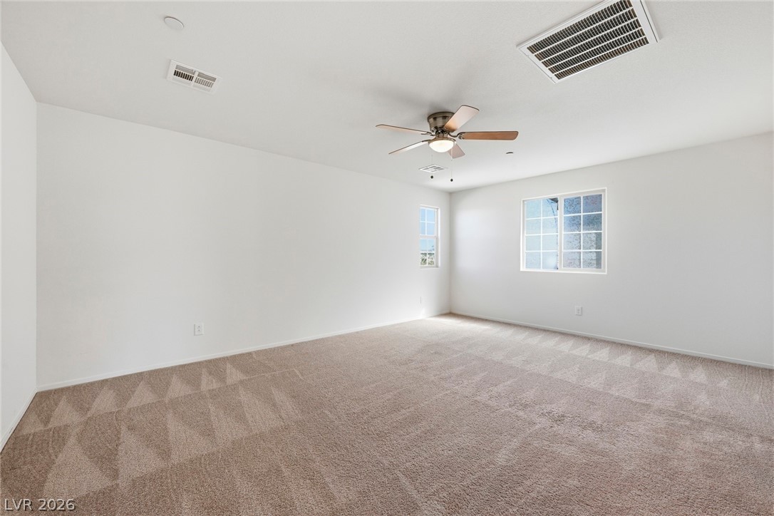 250 Dedication Avenue Henderson, NV 89011 - Photo 33 of 67 Spare room with a ceiling fan and carpet