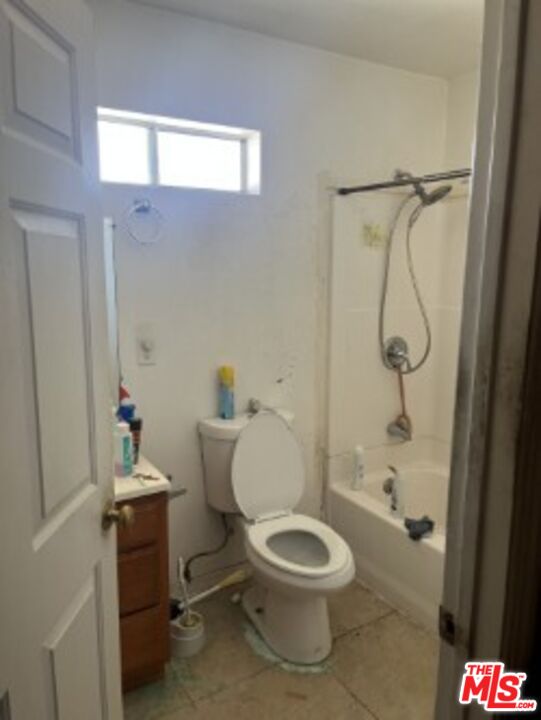 2223 East Oris Street Compton, CA 90222 - Photo 11 of 17 a bathroom with a toilet and a shower