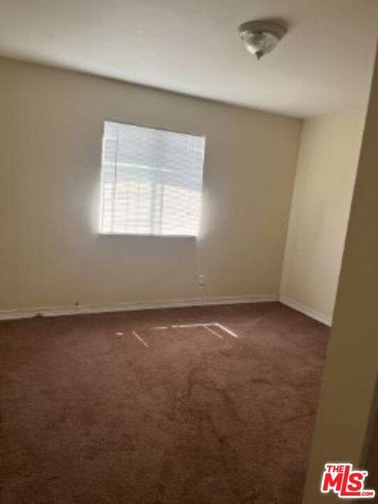 2223 East Oris Street Compton, CA 90222 - Photo 12 of 17 an empty room with a window