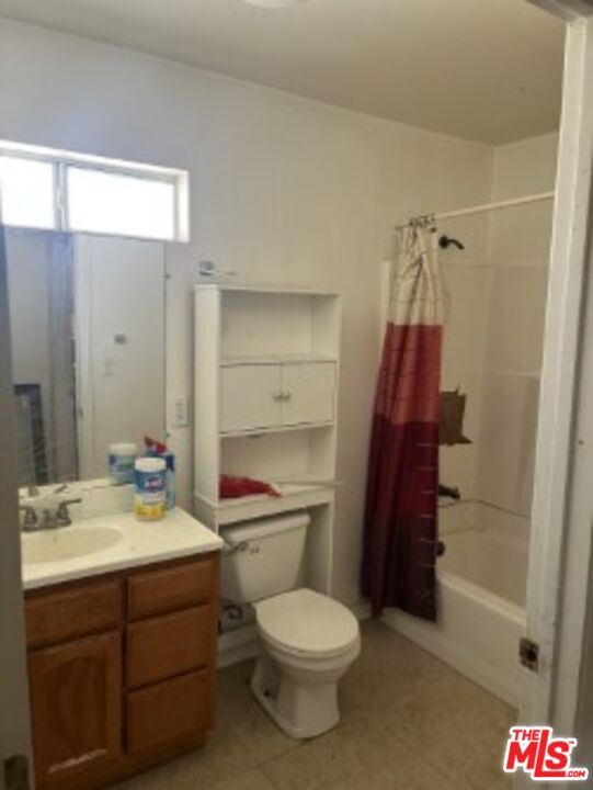 2223 East Oris Street Compton, CA 90222 - Photo 15 of 17 a bathroom with a sink a toilet and shower