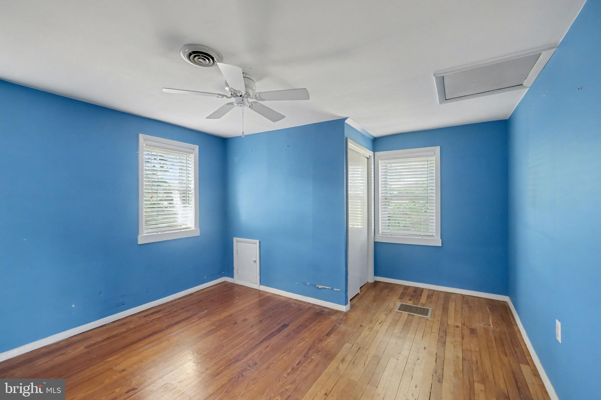 23133 Foxville Road Smithsburg, MD 21783 - Photo 13 of 30 a view of empty room with wooden floor and fan