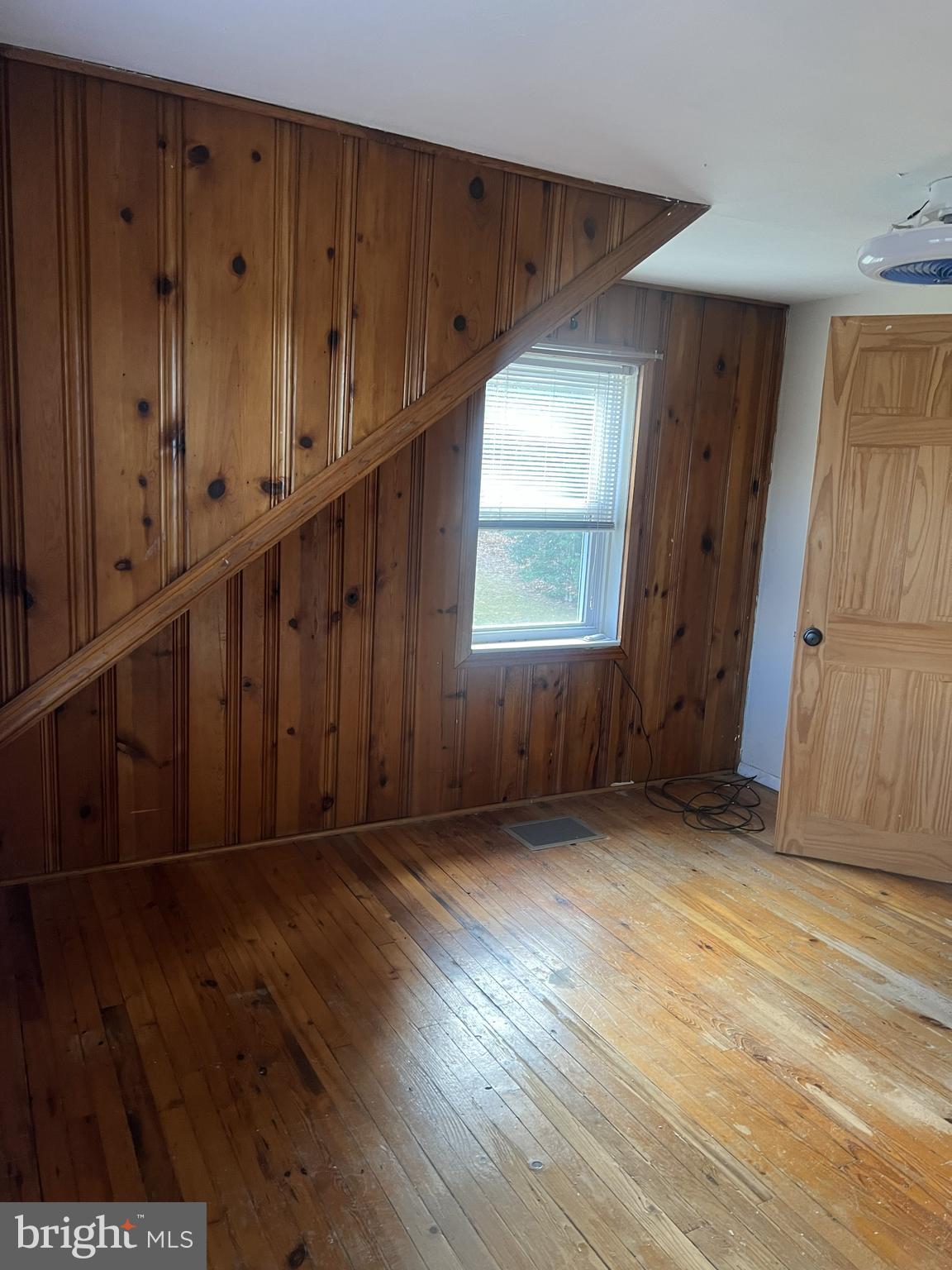 23133 Foxville Road Smithsburg, MD 21783 - Photo 25 of 30 an empty room with wooden floor and windows