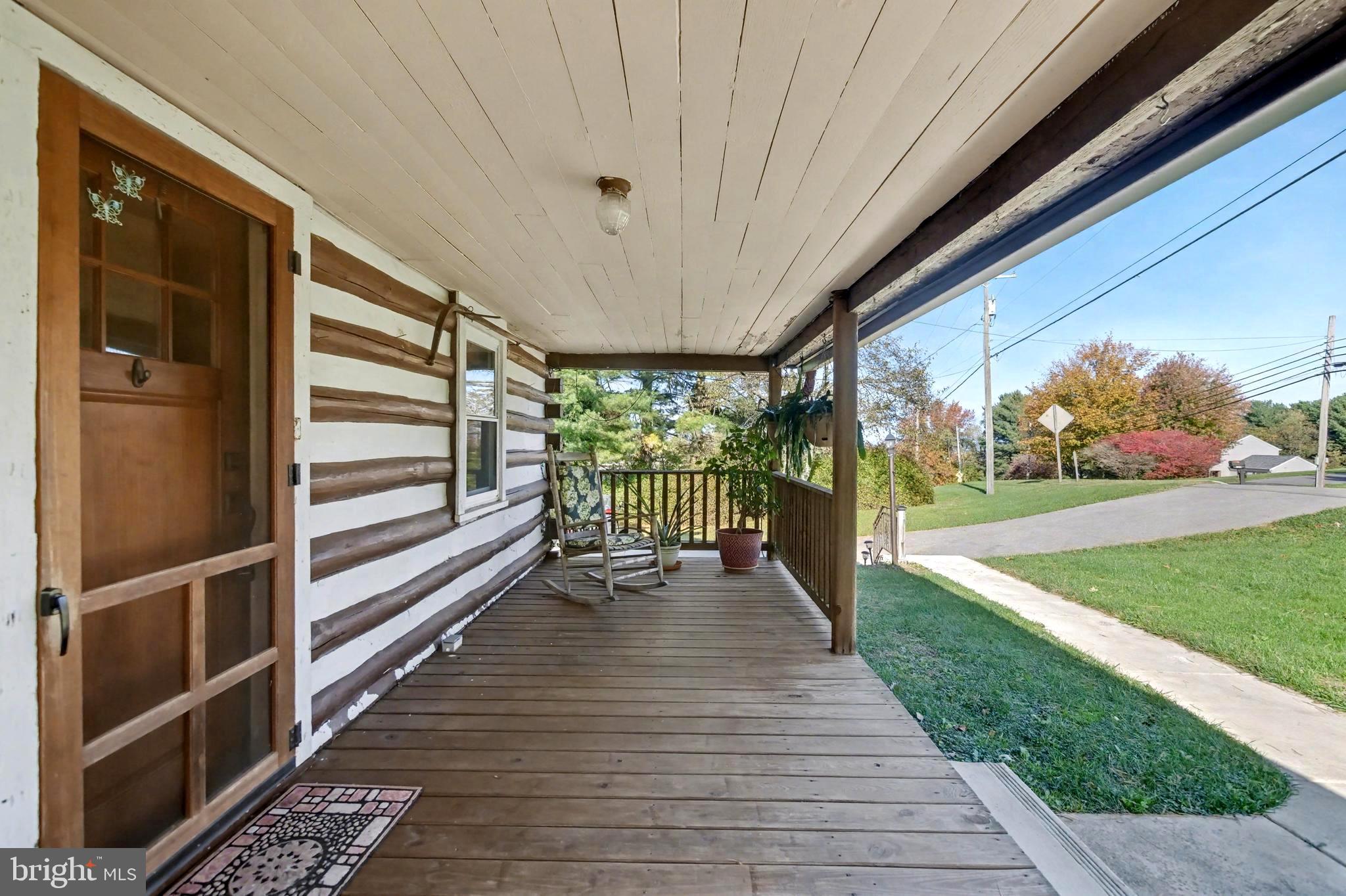23133 Foxville Road Smithsburg, MD 21783 - Photo 3 of 30 a view of a porch with wooden floor and stairs