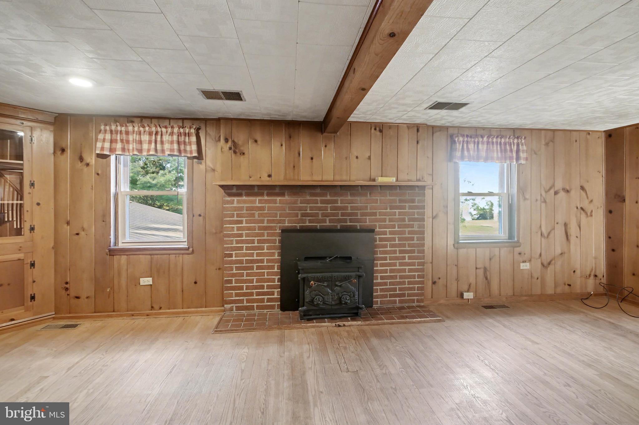23133 Foxville Road Smithsburg, MD 21783 - Photo 9 of 30 an empty room with windows and fireplace