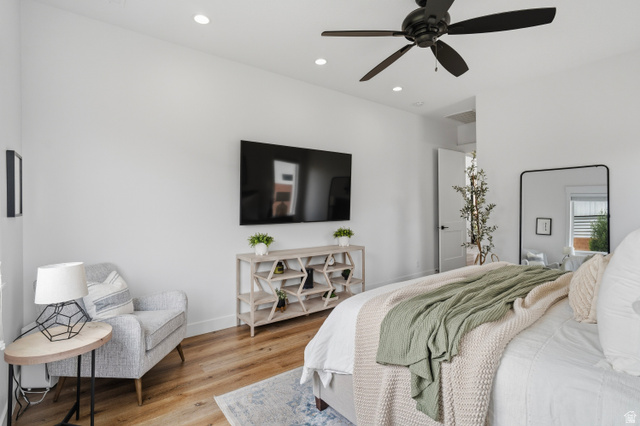 2278 Tawny Ridge Circle St. George, UT 84790 - Photo 22 of 61 Spacious bedroom featuring light wood-finish flooring, recessed lighting, and a modern ceiling fan.