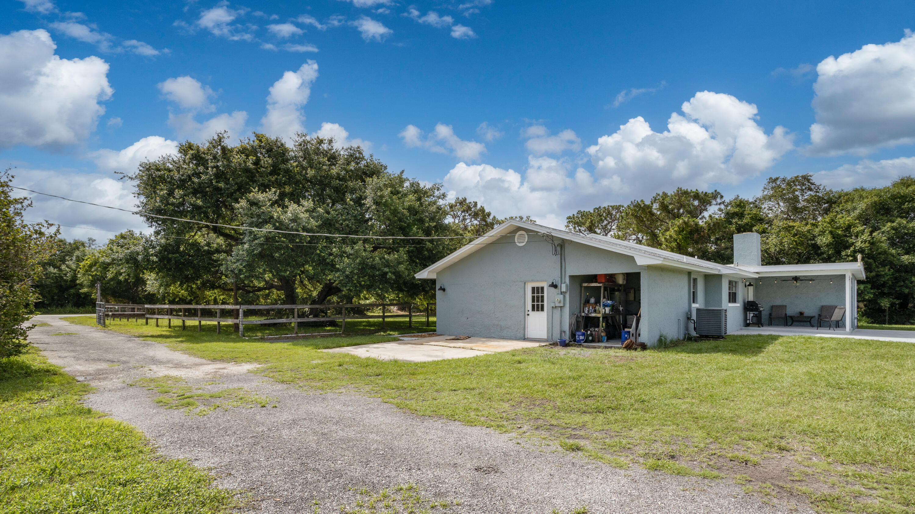 1280 Corey Road Malabar, FL 32950 - Photo 34 of 56 a view of a house with swimming pool and a yard