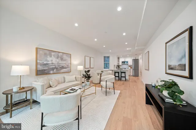 a living room with furniture and a table