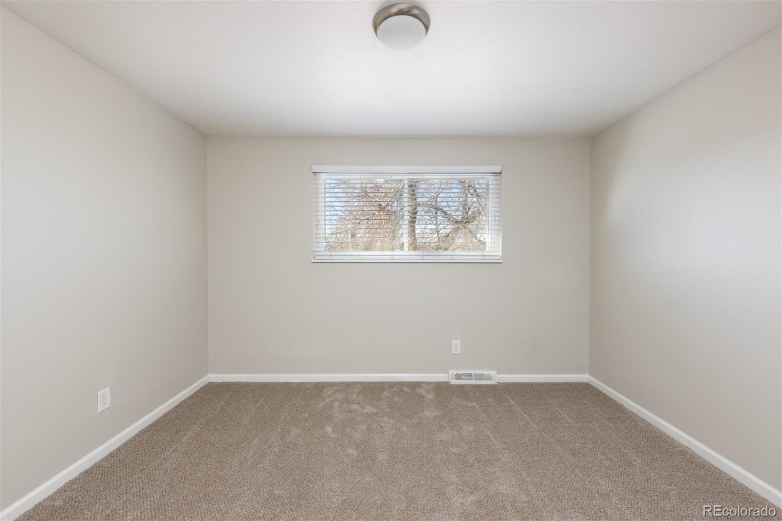 13766 Omega Circle Lone Tree, CO 80124 - Photo 19 of 37 an empty room with a window