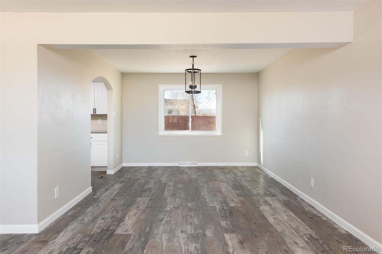 13766 Omega Circle Lone Tree, CO 80124 - Photo 8 of 37 an empty room that has a window in it