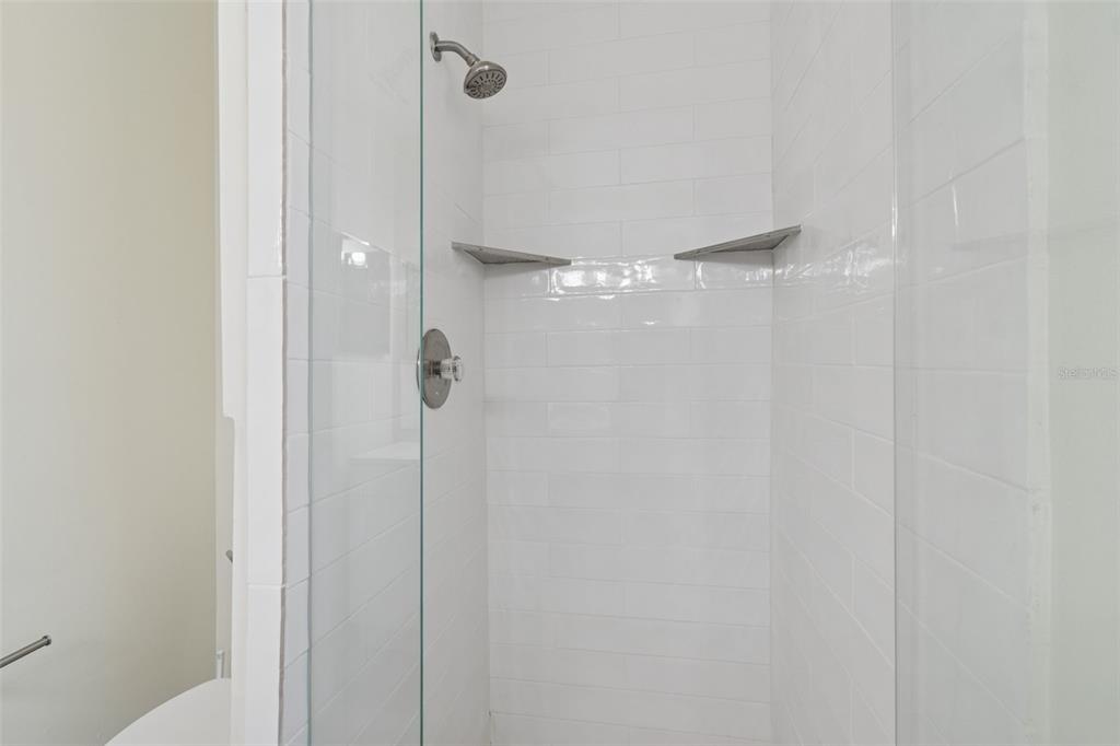 7337 Cambridge Way Clearwater, FL 33764 - Photo 16 of 28 a bathroom with a shower