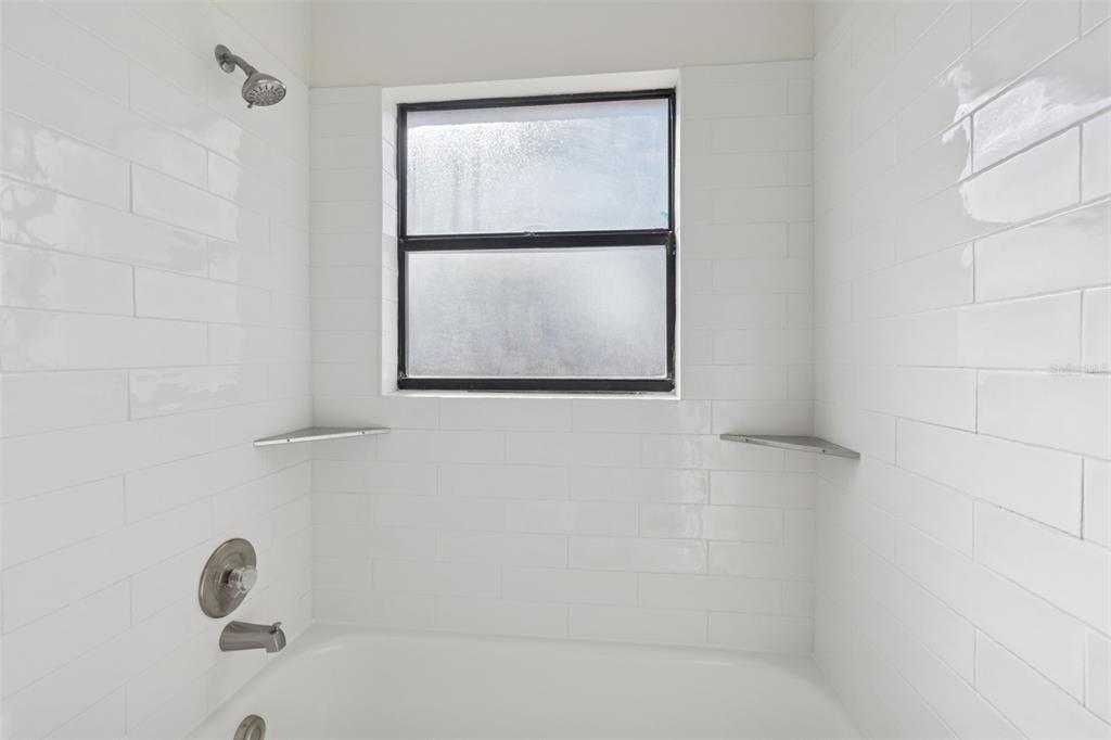 7337 Cambridge Way Clearwater, FL 33764 - Photo 21 of 28 a bathroom with a window