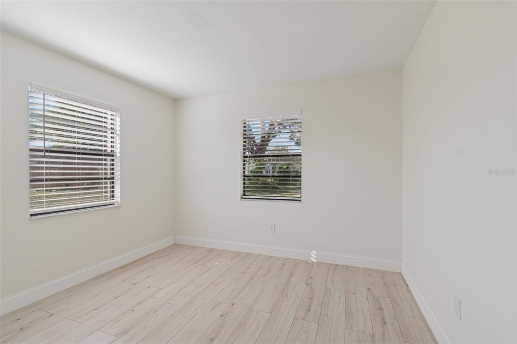 7337 Cambridge Way Clearwater, FL 33764 - Photo 22 of 28 an empty room with a window