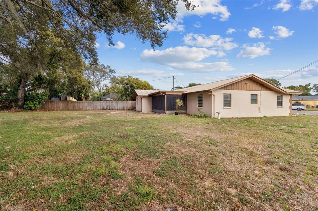 7337 Cambridge Way Clearwater, FL 33764 - Photo 28 of 28 a view of a house with a backyard