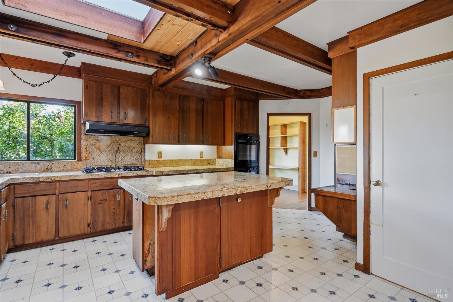 1830 Howell Mountain Road St. Helena, CA 94574 - Photo 11 of 33 a kitchen with a stove a sink and a refrigerator