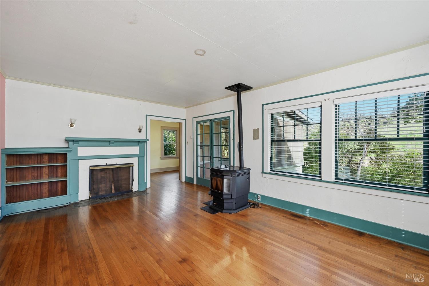 1830 Howell Mountain Road St. Helena, CA 94574 - Photo 14 of 33 a view of an empty room with wooden floor and a window