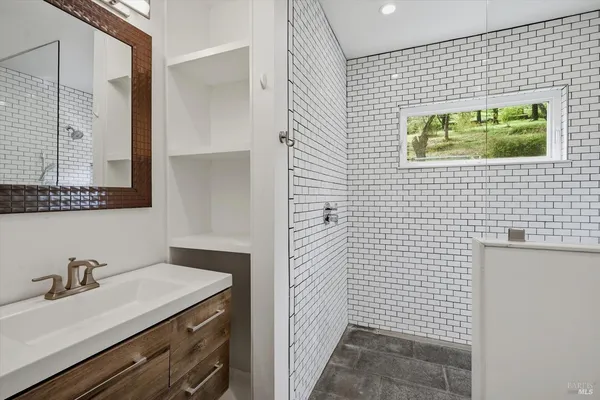 a bathroom with a sink and a mirror