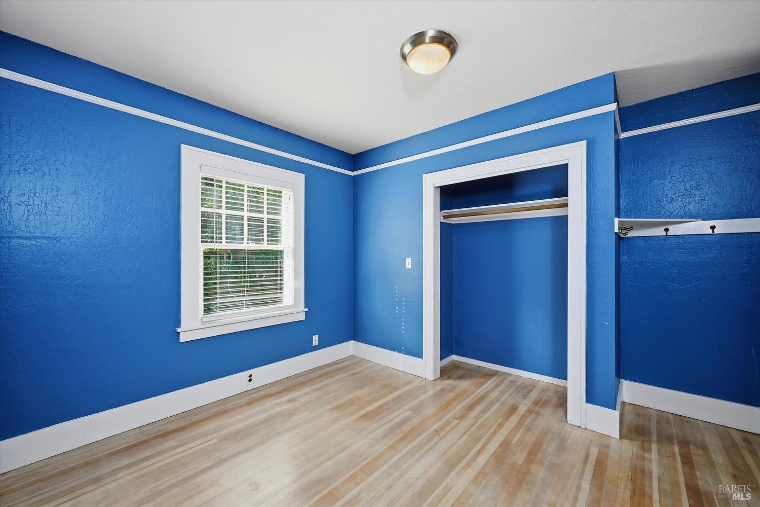 1830 Howell Mountain Road St. Helena, CA 94574 - Photo 19 of 33 a view of empty room with wooden floor and fan