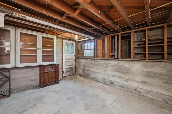 a view of an empty room with wooden walls