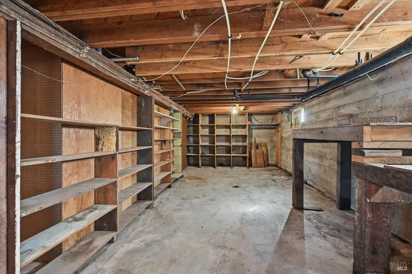 a view of an empty room with a garage