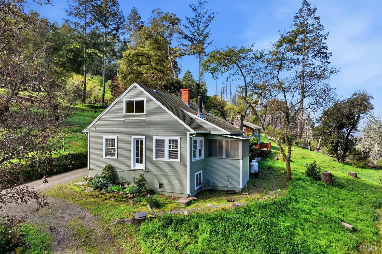 1830 Howell Mountain Road St. Helena, CA 94574 - Photo 3 of 33 a front view of a house with a yard