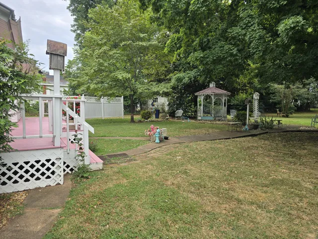 a view of a chairs and table in a patio