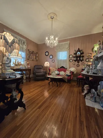 a living room with lots of furniture and a chandelier