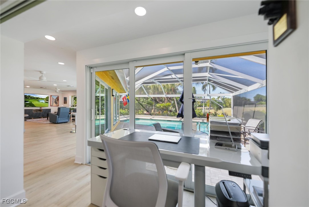 1264 Par View Drive Sanibel, FL 33957 - Photo 11 of 50 a dining room with furniture a chandelier and wooden floor